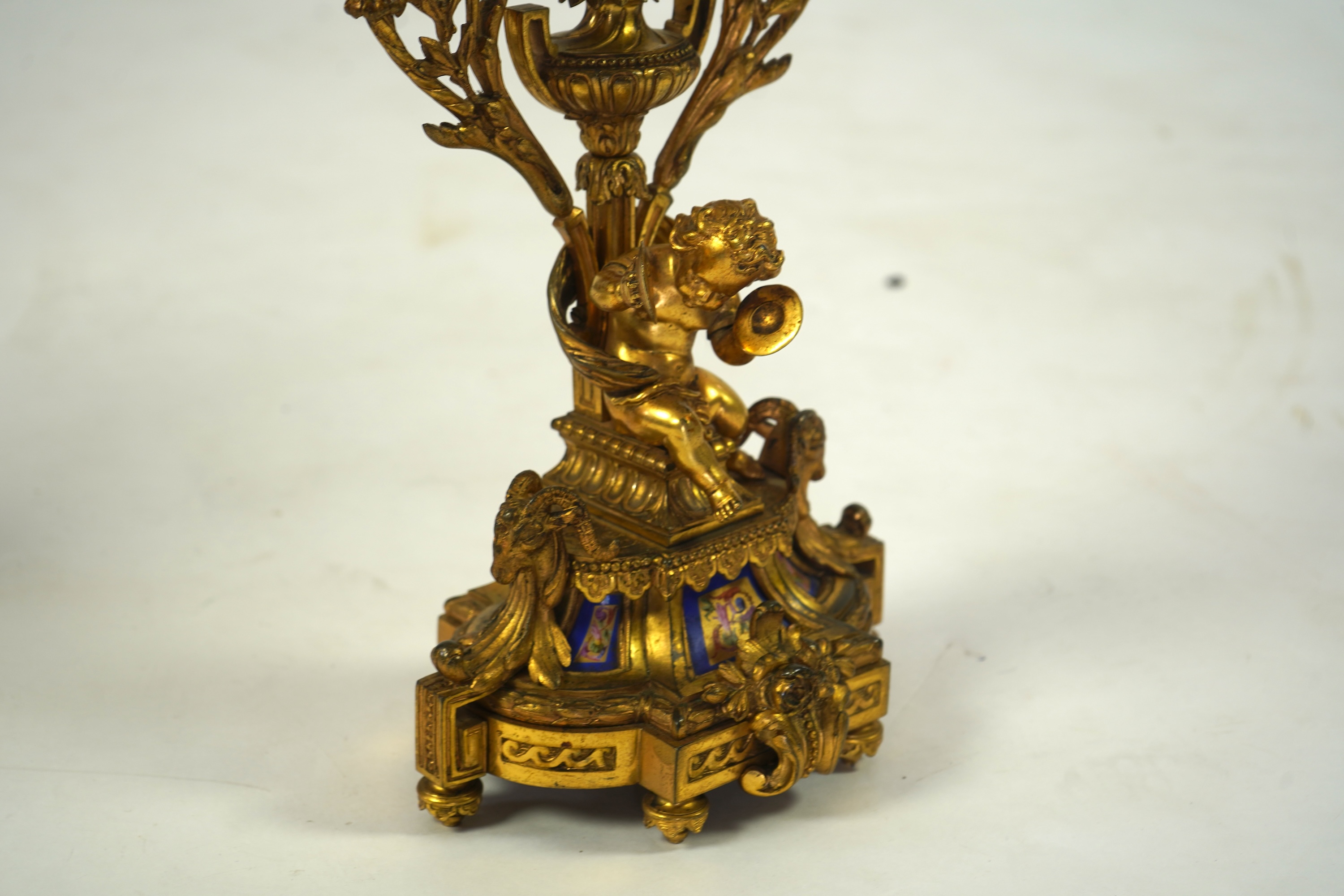A pair of 19th century French Louis XVI style ormolu three light candelabra